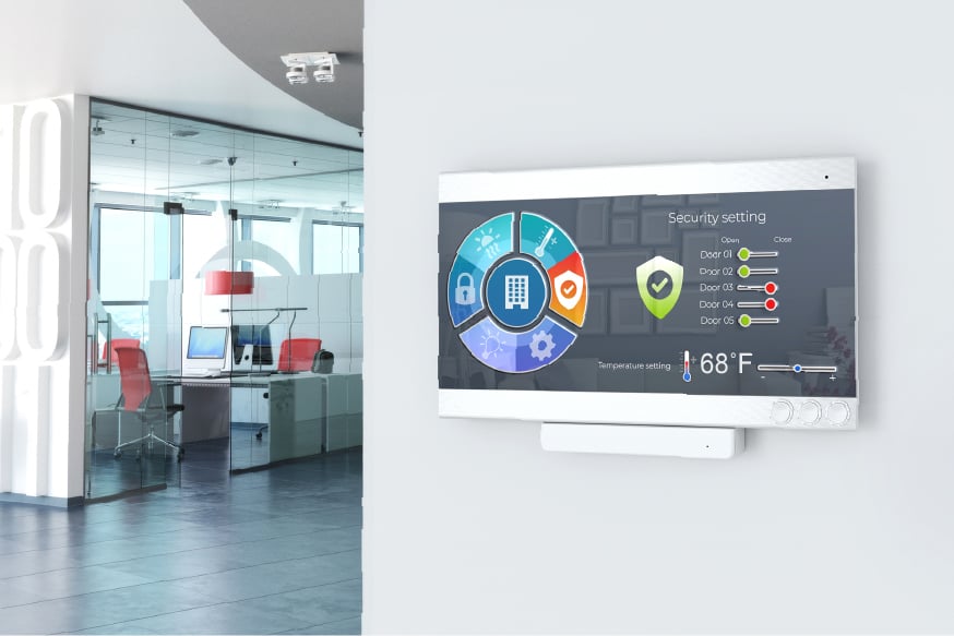 Modern office with control panel for controlling lighting, temperature, air quality, access and safety.